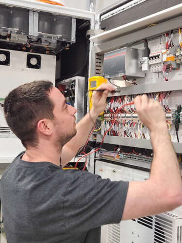 Man tests inverter at South Carolina factory.